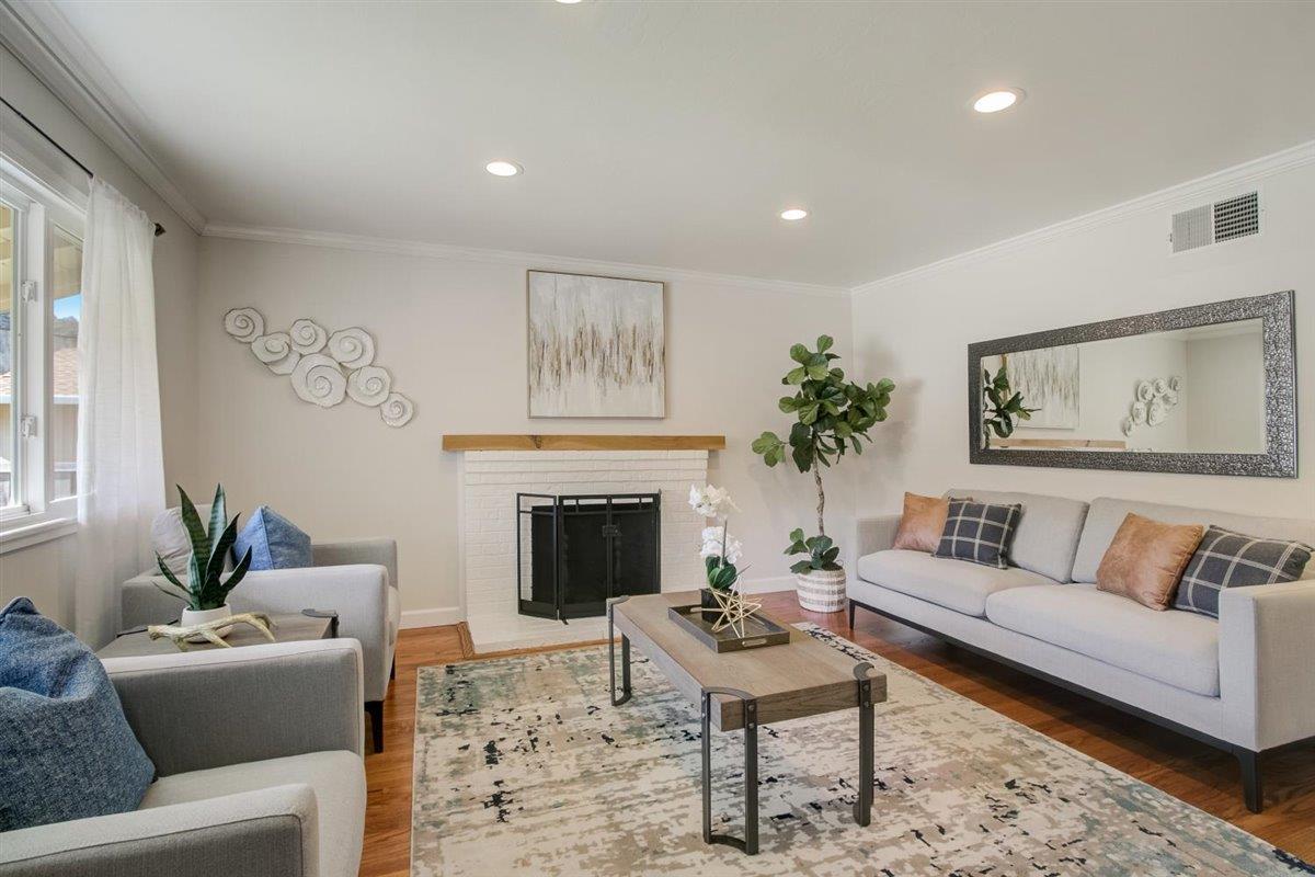 855 Standish Road Pacifica, CA 94044 - Photo 3 of 77 a living room with furniture and a fireplace