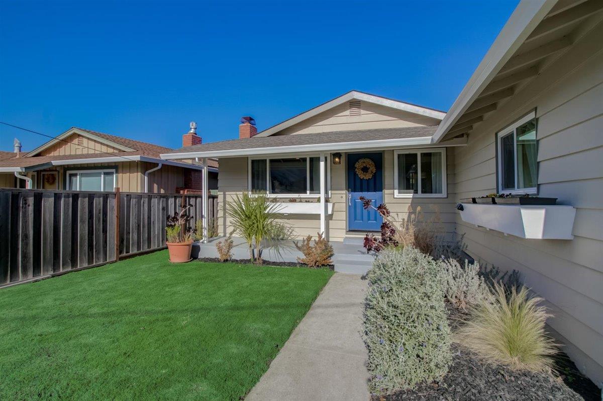 855 Standish Road Pacifica, CA 94044 - Photo 41 of 77 a front view of a house with a yard table and chairs