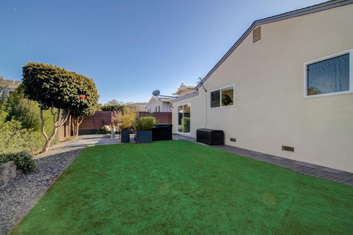 855 Standish Road Pacifica, CA 94044 - Photo 47 of 77 a view of a backyard with plants and a patio