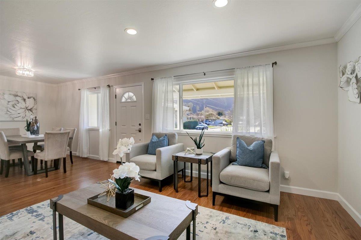 855 Standish Road Pacifica, CA 94044 - Photo 5 of 77 a living room with furniture a rug and a wooden floor