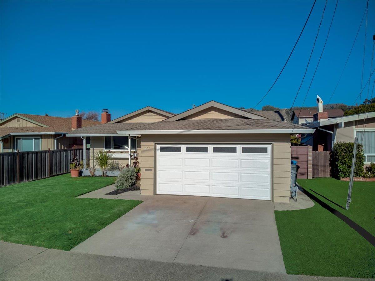 855 Standish Road Pacifica, CA 94044 - Photo 54 of 77 a front view of a house with a garden and yard