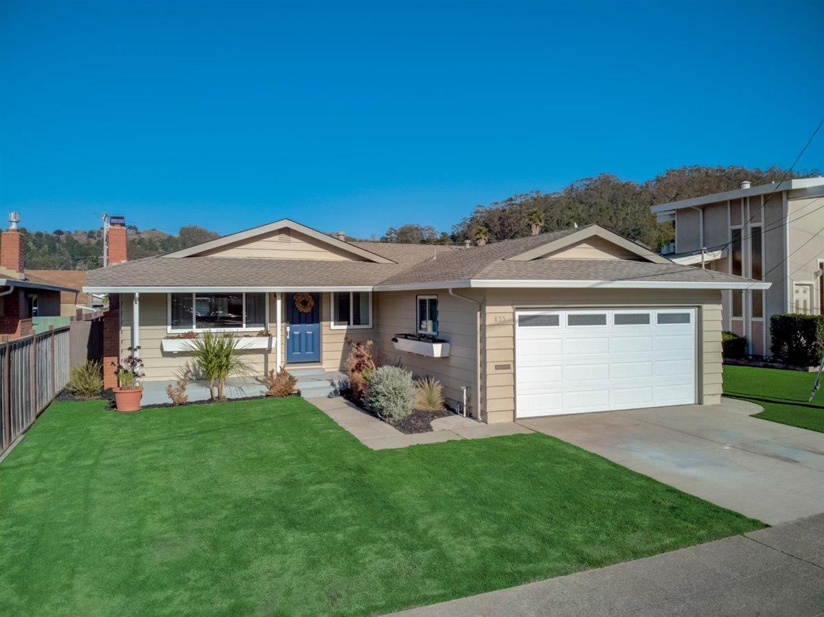 855 Standish Road Pacifica, CA 94044 - Photo 55 of 77 a front view of a house with a garden and yard