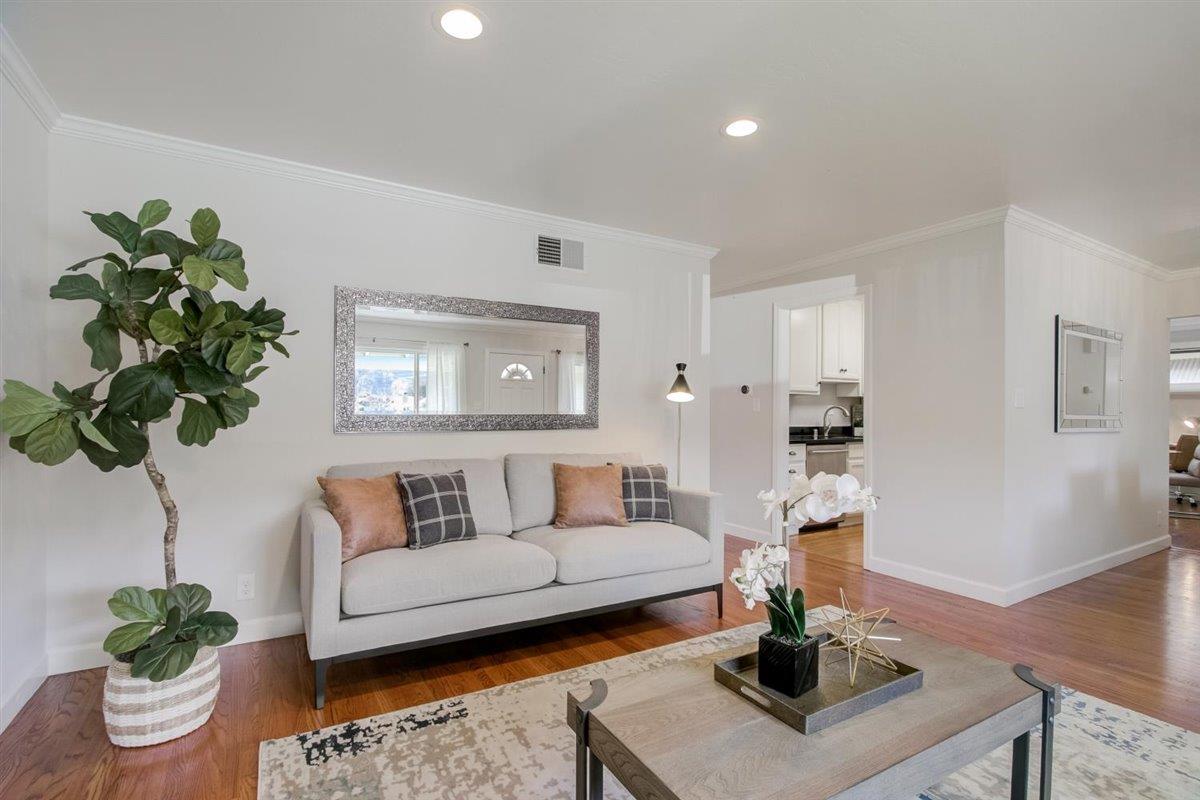 855 Standish Road Pacifica, CA 94044 - Photo 7 of 77 a living room with furniture and a potted plant