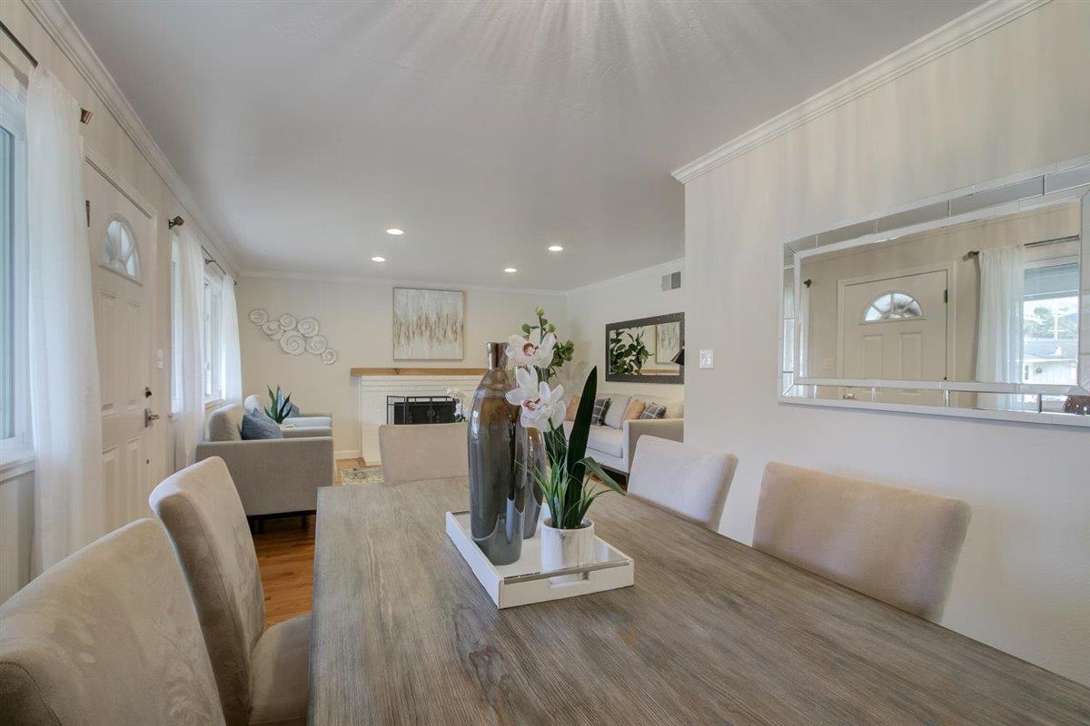 855 Standish Road Pacifica, CA 94044 - Photo 76 of 77 a living room with furniture fireplace and wooden floor
