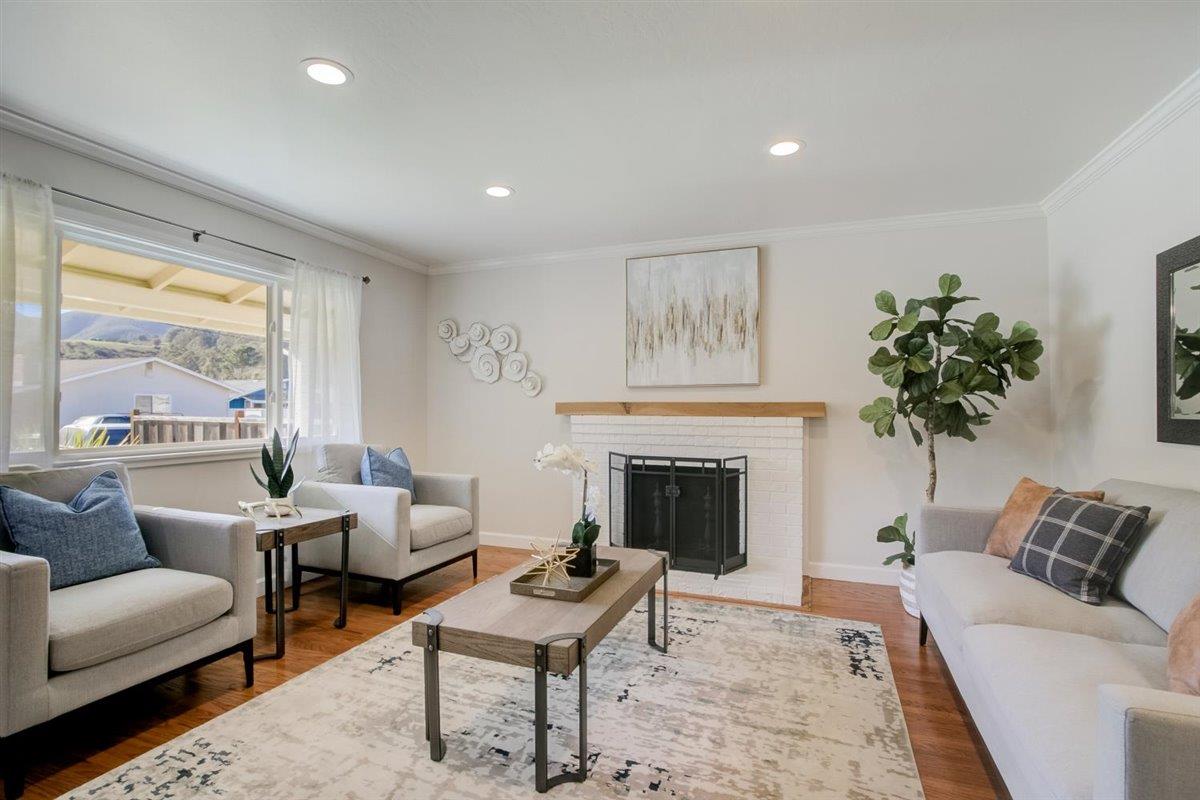 855 Standish Road Pacifica, CA 94044 - Photo 8 of 77 a living room with furniture and a fireplace