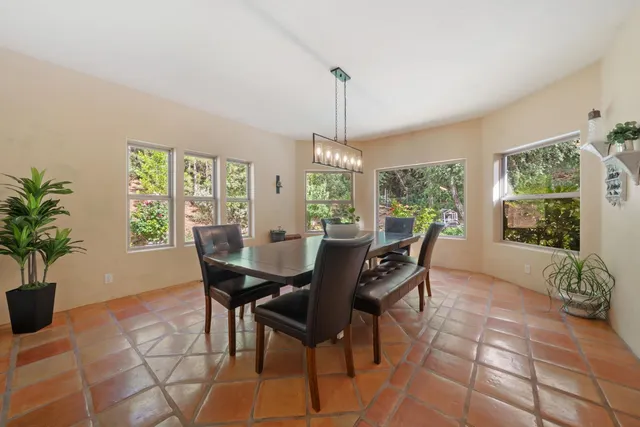 a bedroom with a large bed and a large window