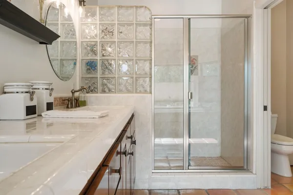 a view of a kitchen with furniture and wooden floor
