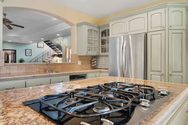 a kitchen with a sink and cabinets