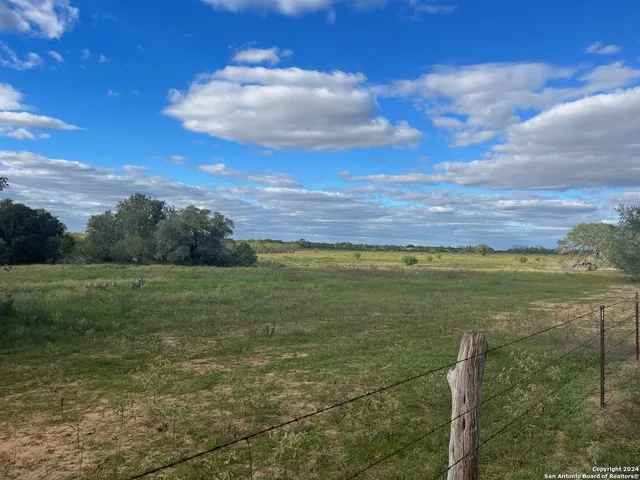 a view of an ocean and a yard
