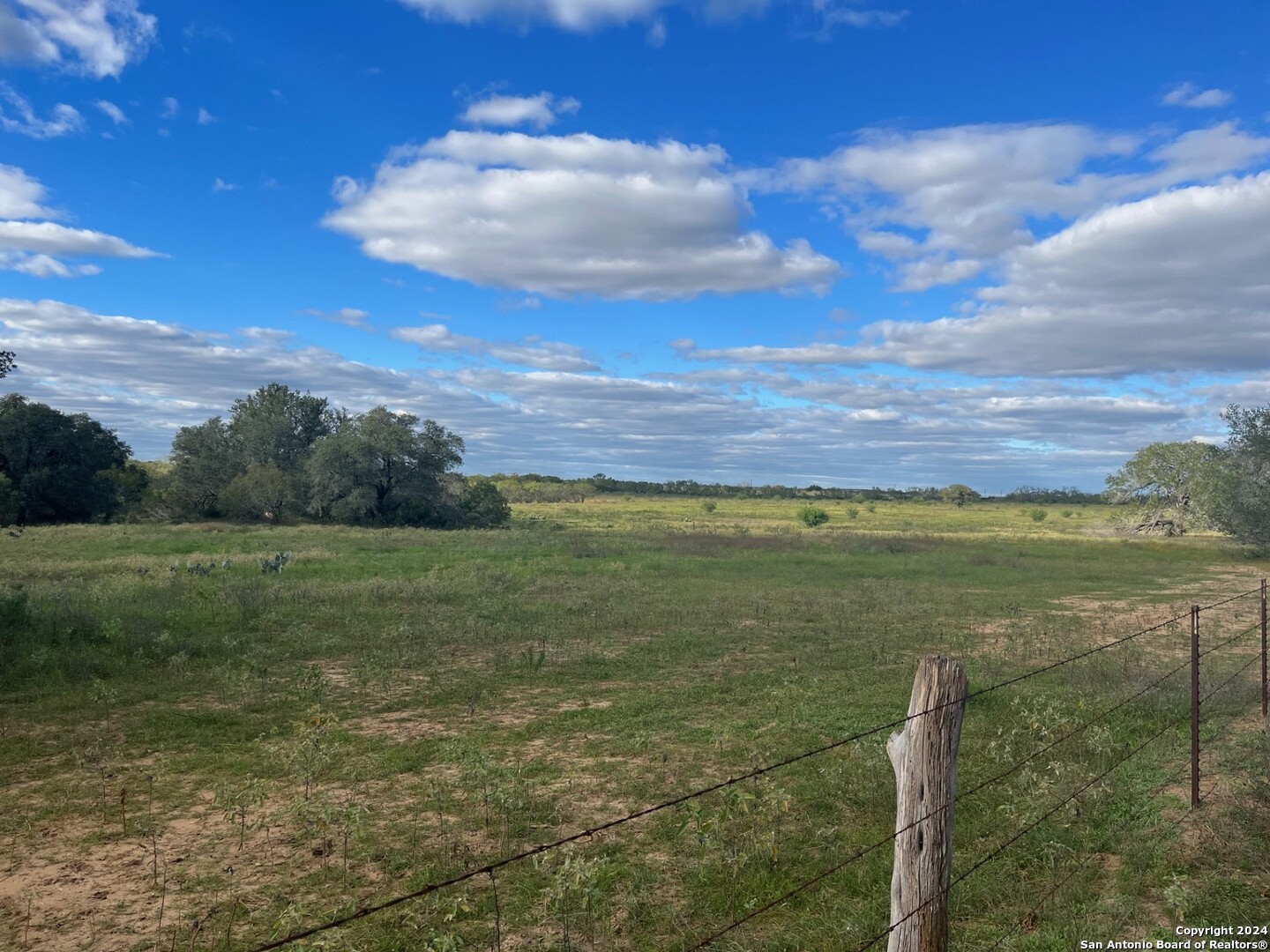 a view of an ocean and a yard