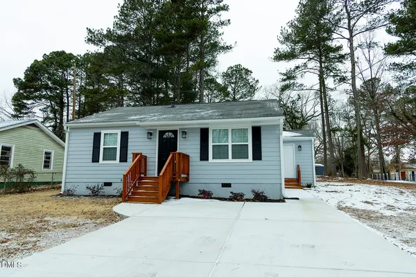 a front view of house with a barbeque