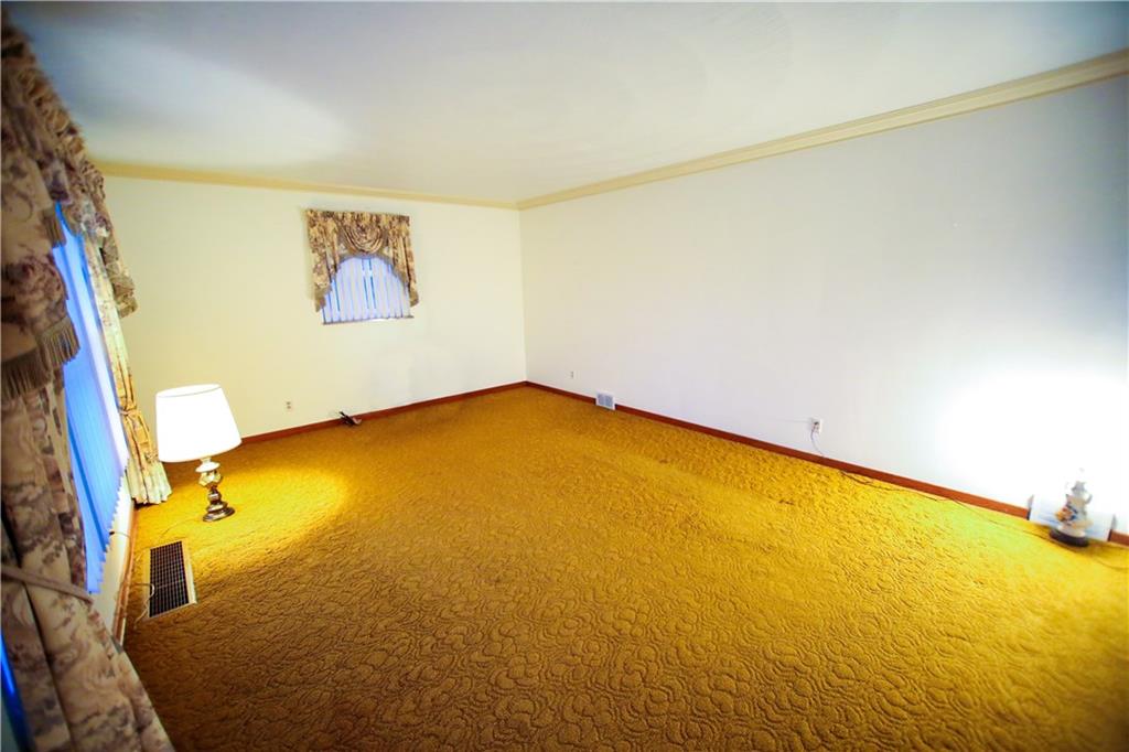 1161 Bonniebrook Road Butler, PA 16002 - Photo 15 of 25 Large living Room with crown molding and hardwoods under carpet