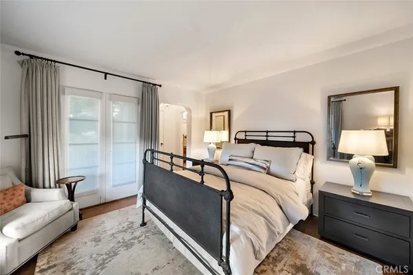 a bedroom with bed and window