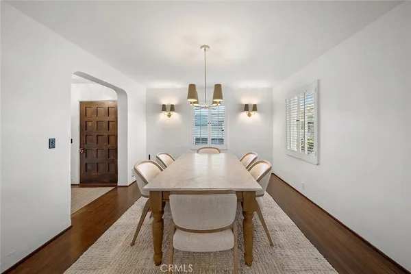 a dining room with a table and chairs
