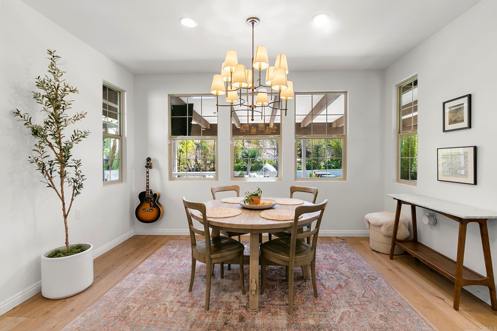 7001 Sitio Frontera Carlsbad, CA 92009 - Photo 13 of 40 a view of a dining room with furniture window and outside view