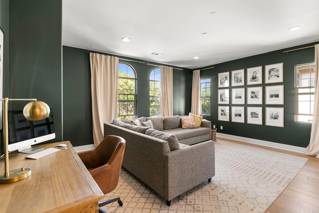 7001 Sitio Frontera Carlsbad, CA 92009 - Photo 25 of 40 a living room with furniture and a large window