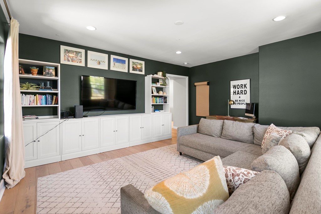 7001 Sitio Frontera Carlsbad, CA 92009 - Photo 26 of 40 a living room with furniture and a flat screen tv