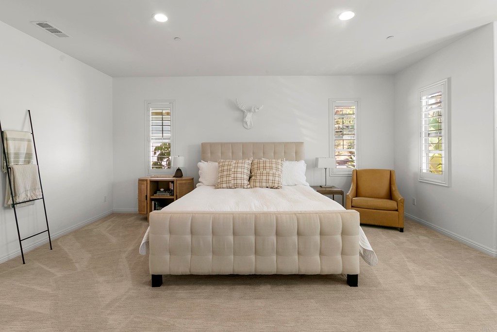 7001 Sitio Frontera Carlsbad, CA 92009 - Photo 29 of 40 a bedroom with a bed and window