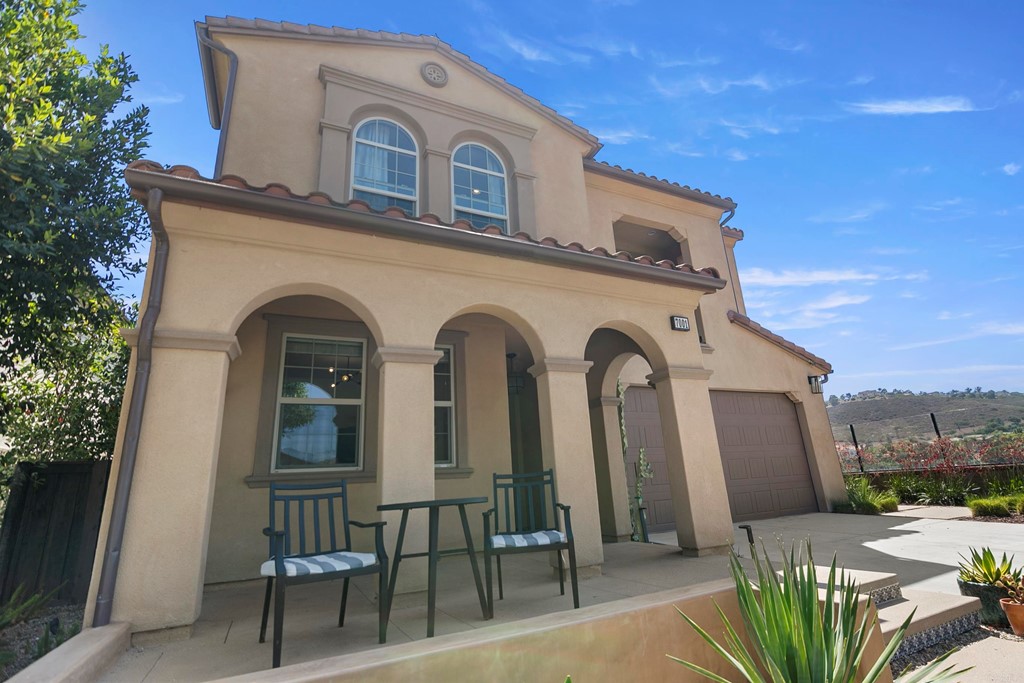 7001 Sitio Frontera Carlsbad, CA 92009 - Photo 3 of 40 a front view of a house with garden