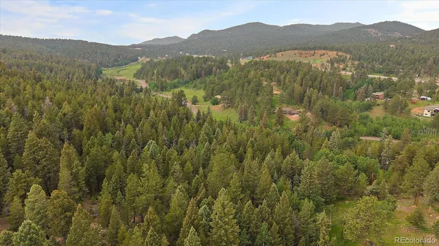 a view of a town with mountains in the background