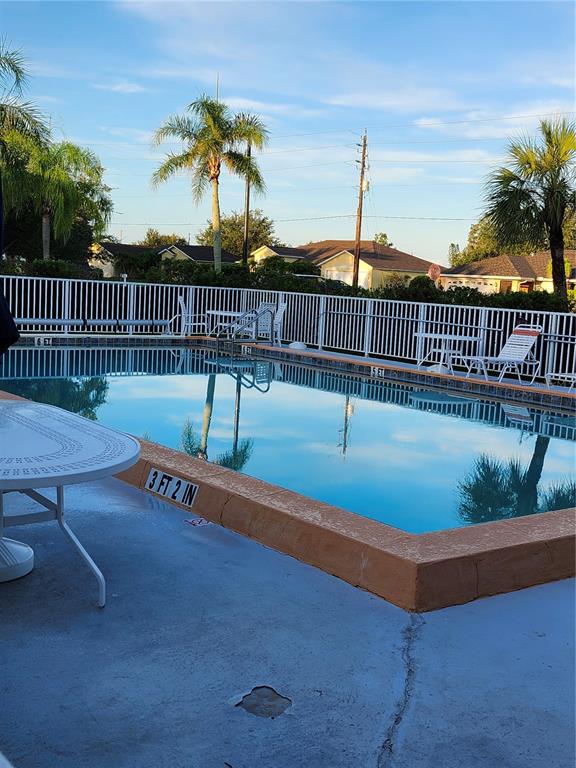 1216 Rio De Janeiro Avenue, Unit 301 Punta Gorda, FL 33983 - Photo 15 of 15 a view of swimming pool with outdoor seating