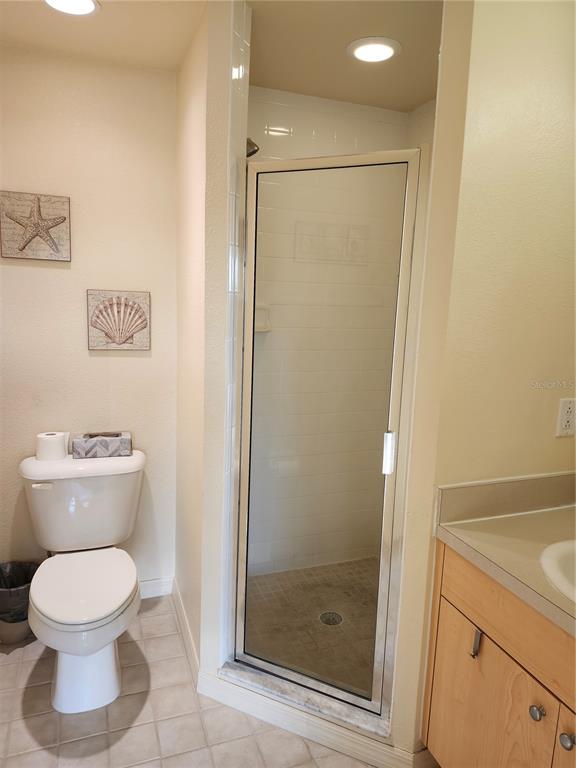 1216 Rio De Janeiro Avenue, Unit 301 Punta Gorda, FL 33983 - Photo 9 of 15 a bathroom with a toilet and a shower