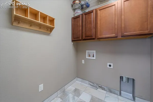 a view of cabinets and utility room