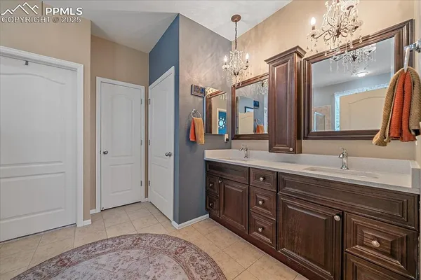 a spacious bathroom with a double vanity sink double and a mirror