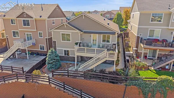 an aerial view of house with yard swimming pool and outdoor seating