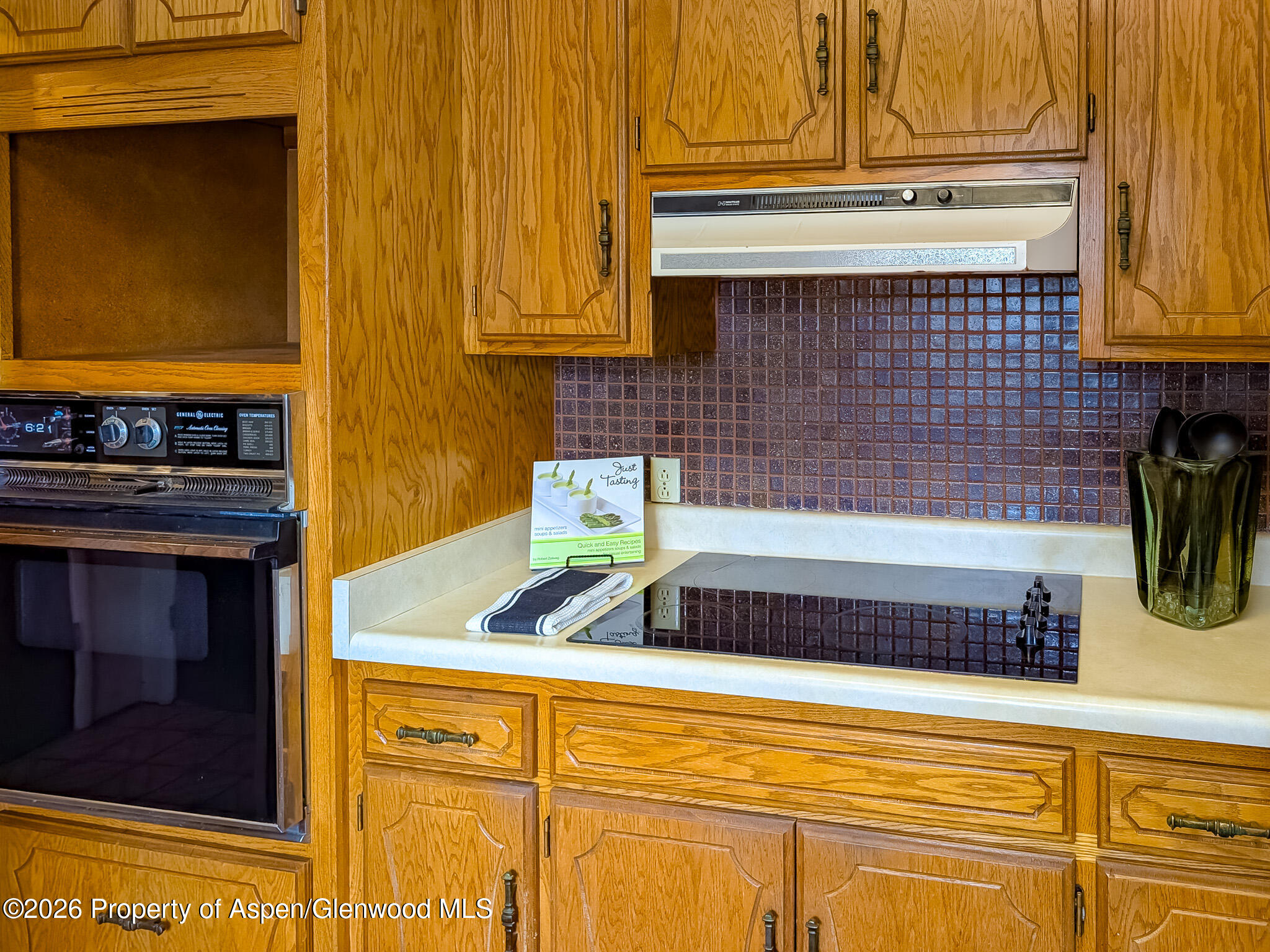 410 Fairway Avenue Rifle, CO 81650 - Photo 14 of 37 a kitchen with a sink stove and microwave