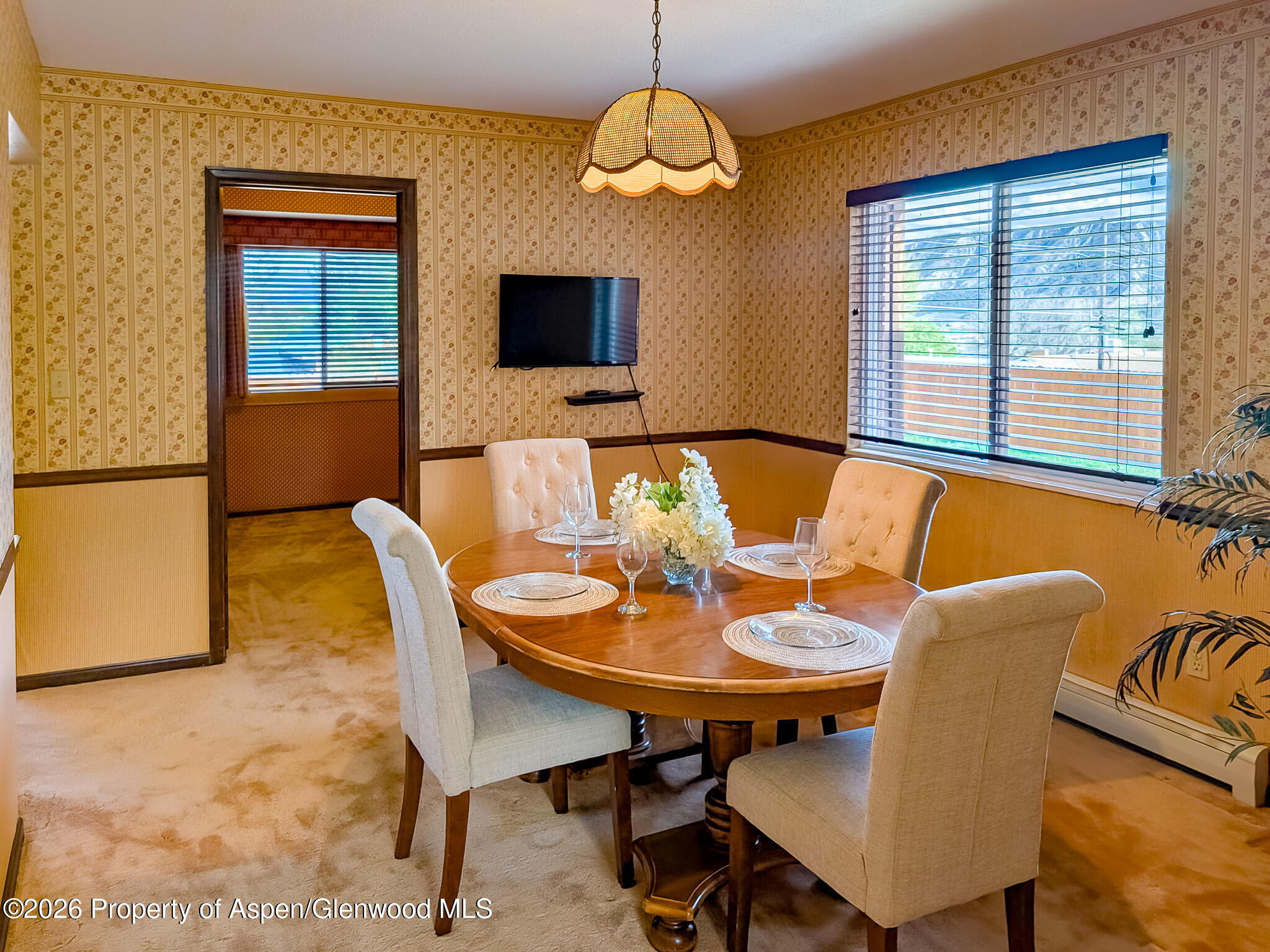 410 Fairway Avenue Rifle, CO 81650 - Photo 16 of 37 a view of a dining room with furniture window and wooden floor