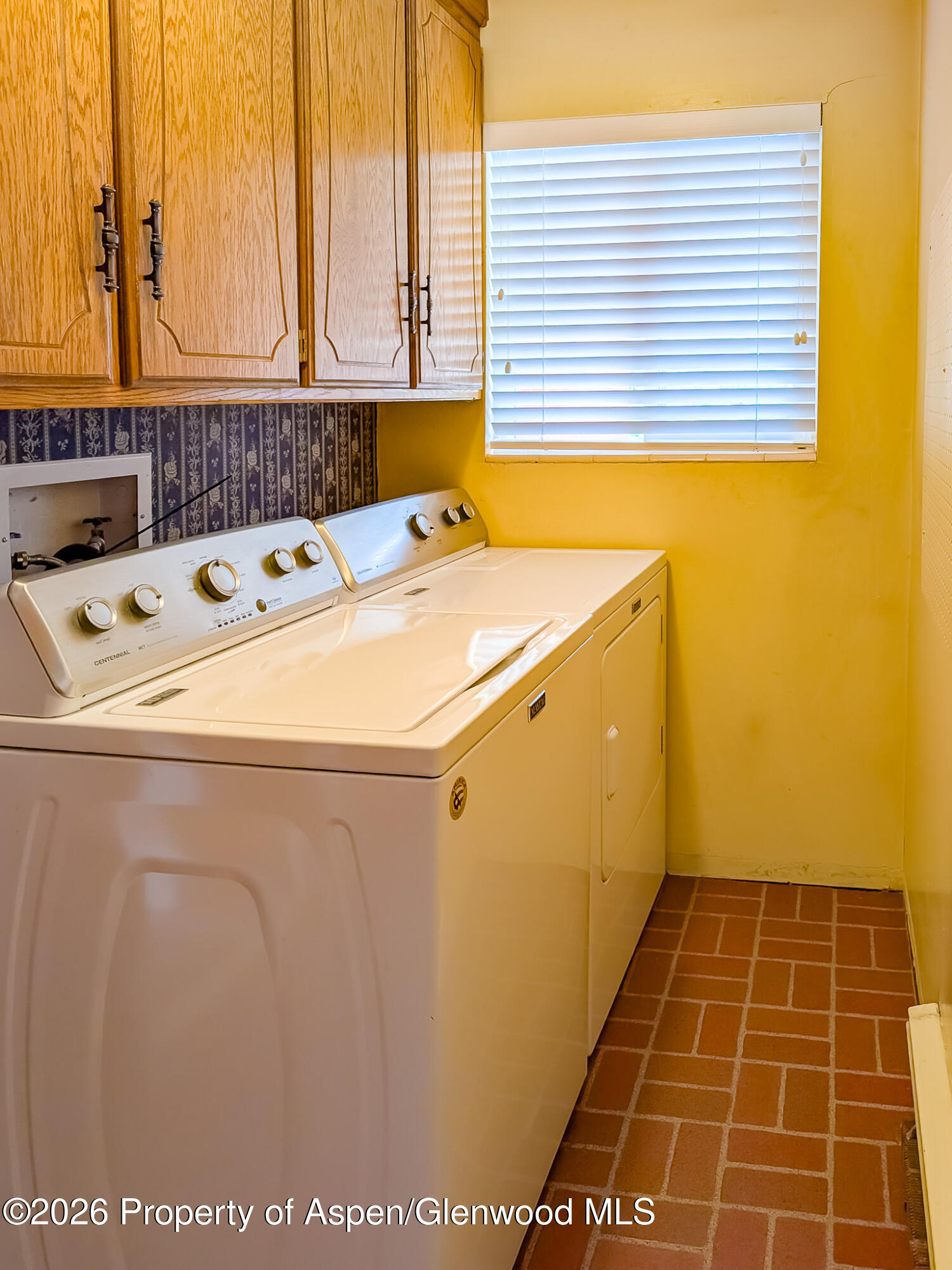 410 Fairway Avenue Rifle, CO 81650 - Photo 17 of 37 a utility room with dryer and window