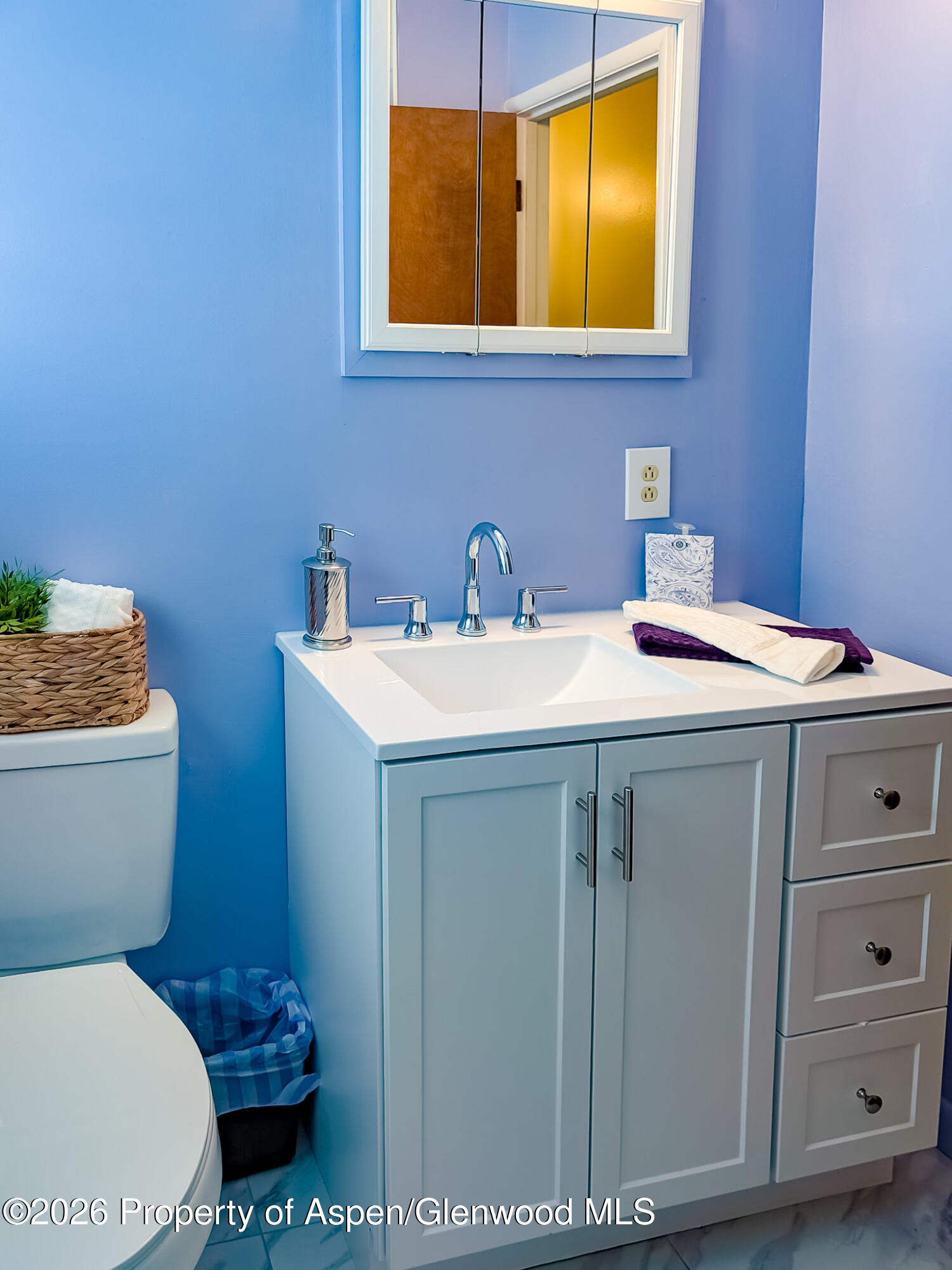 410 Fairway Avenue Rifle, CO 81650 - Photo 21 of 37 a bathroom with a sink toilet and mirror