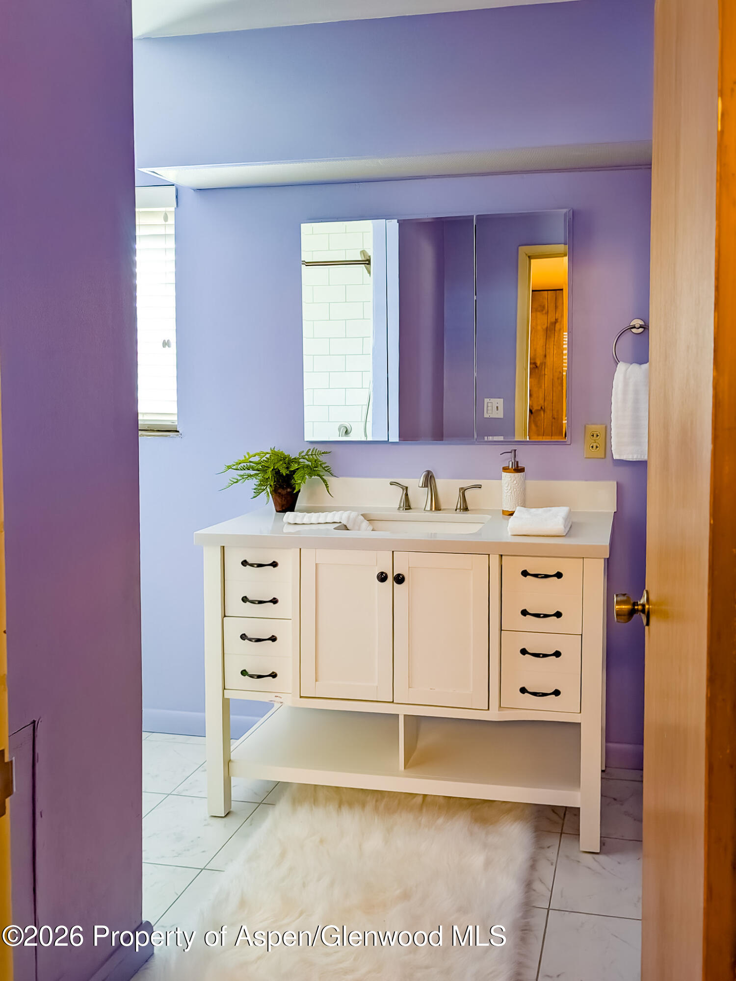 410 Fairway Avenue Rifle, CO 81650 - Photo 29 of 37 a bathroom with a sink a vanity and a mirror
