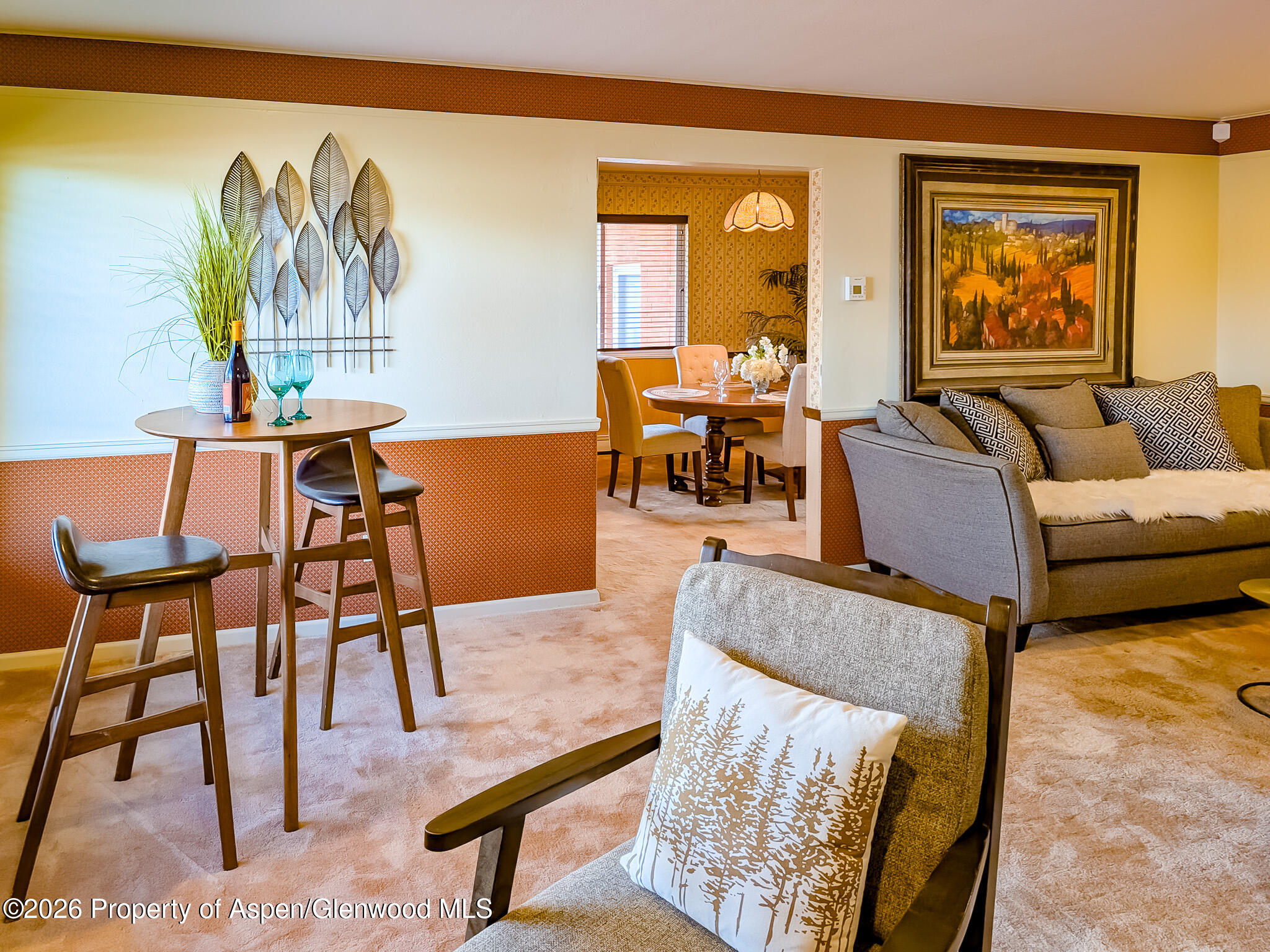 410 Fairway Avenue Rifle, CO 81650 - Photo 7 of 37 a living room with furniture and a painting on the wall