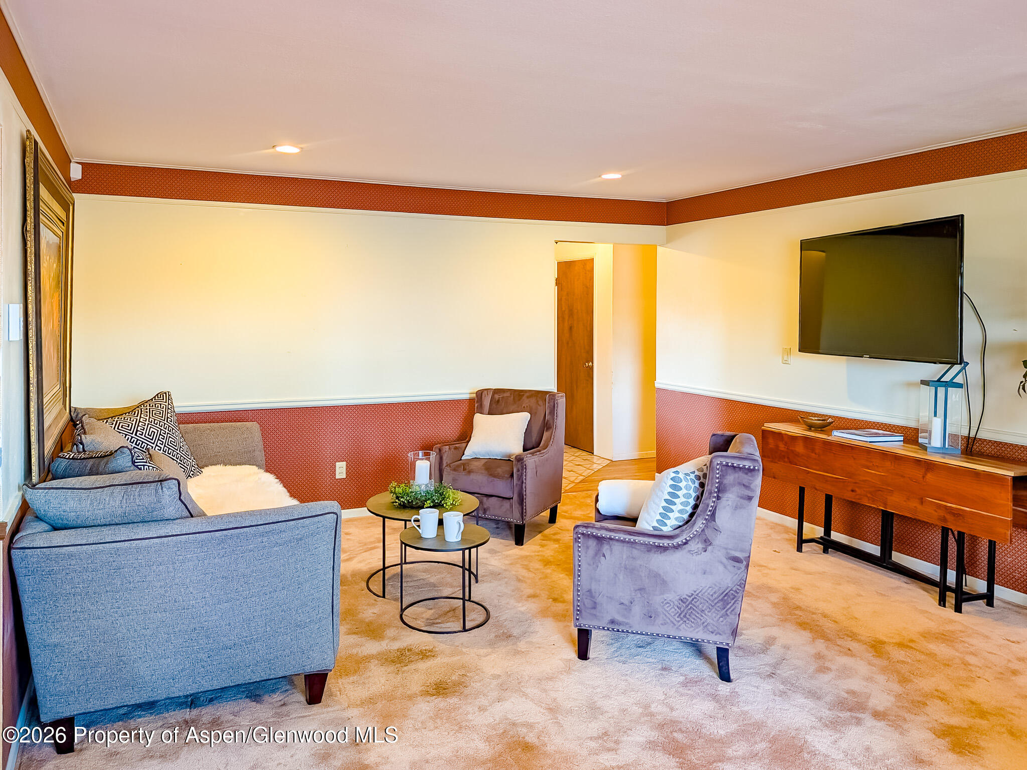 410 Fairway Avenue Rifle, CO 81650 - Photo 8 of 37 a living room with furniture and a flat screen tv