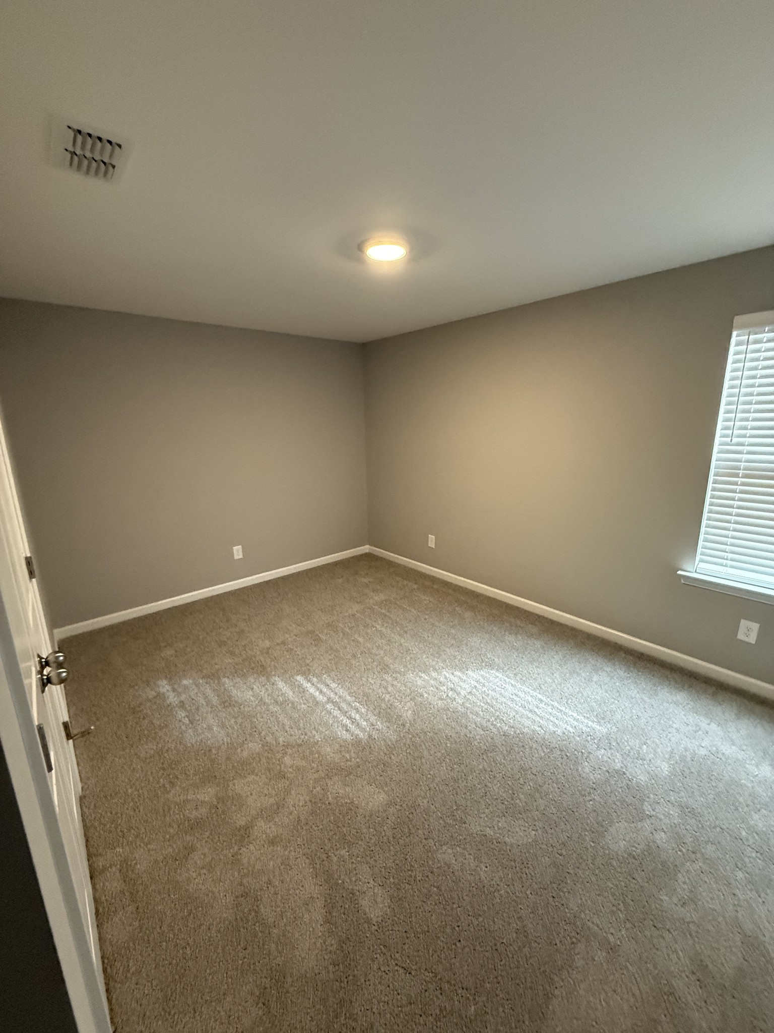 525 Windflower Pass Antioch, TN 37013 - Photo 19 of 22 an empty room with windows