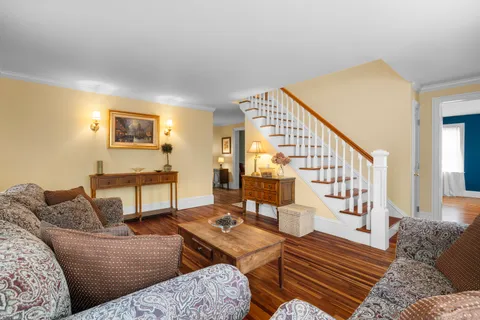 a bedroom with a bed and a book shelf