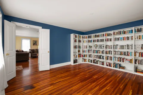 a living room with furniture a fireplace and a window