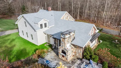 a aerial view of a house with a big yard