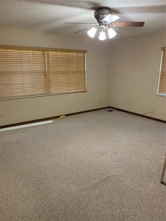 4661 Anderson Road, Unit 4661 Kissimmee, FL 34746 - Photo 11 of 14 a view of an empty room with a window