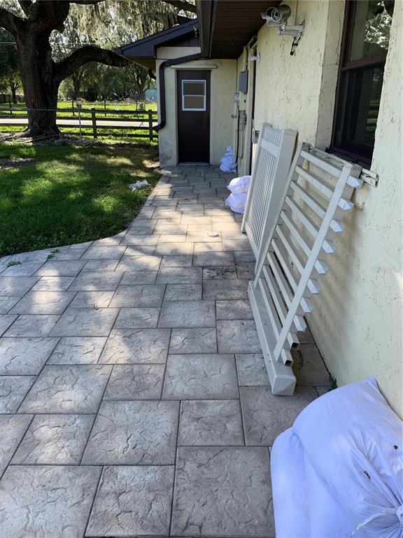 4661 Anderson Road, Unit 4661 Kissimmee, FL 34746 - Photo 14 of 14 a view of a backyard with sitting area