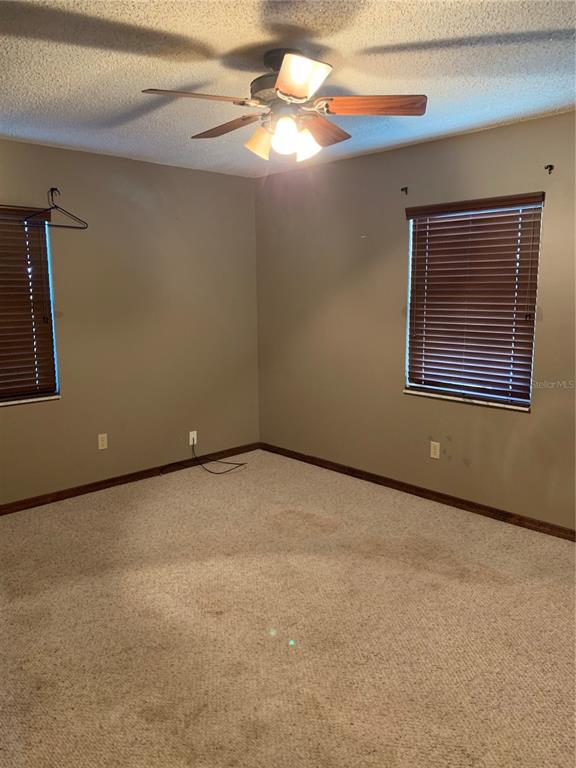 4661 Anderson Road, Unit 4661 Kissimmee, FL 34746 - Photo 10 of 14 a view of an empty room with a window