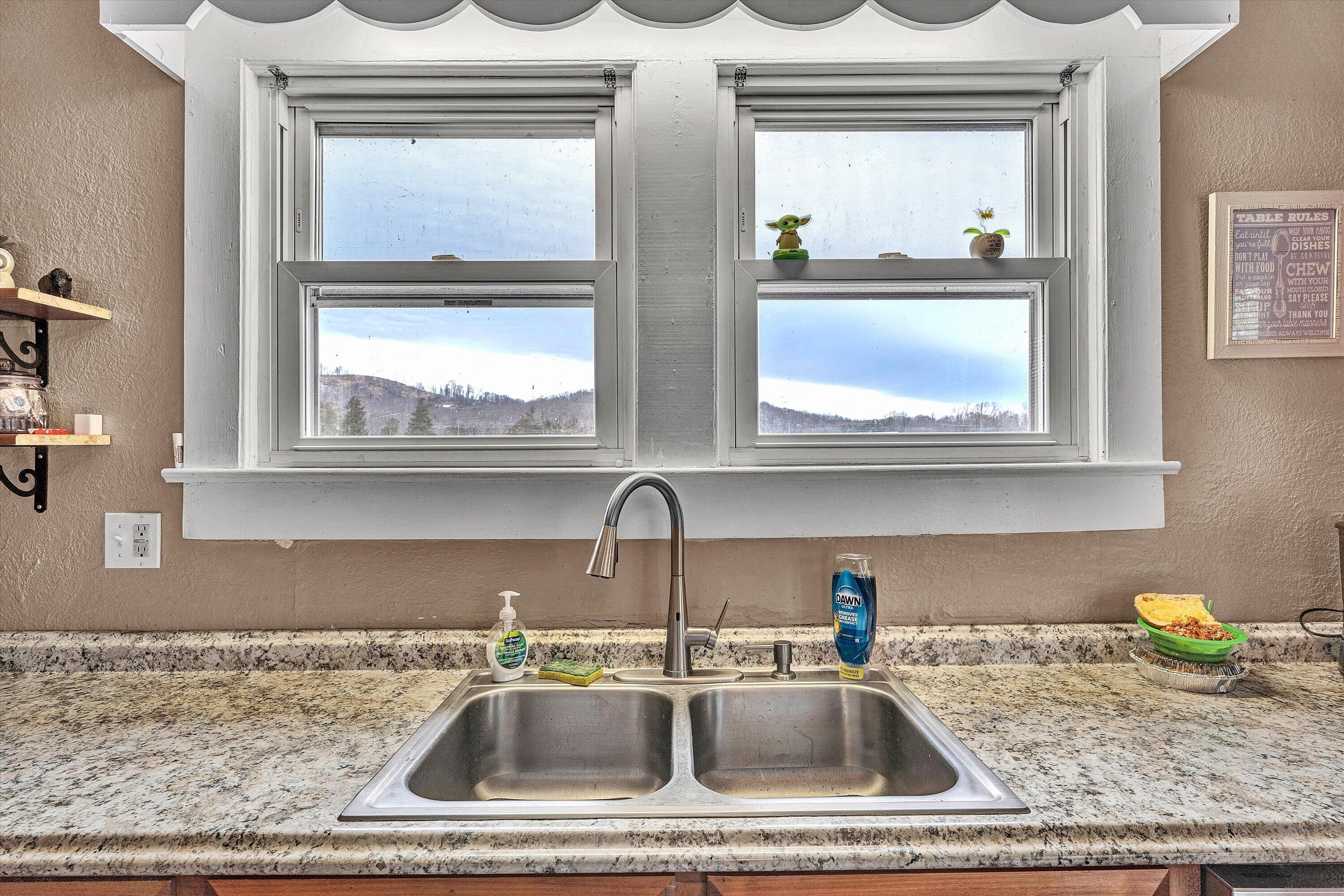 1045 Emerald Drive Goodview, VA 24095 - Photo 17 of 46 a kitchen with a sink a stove and a window