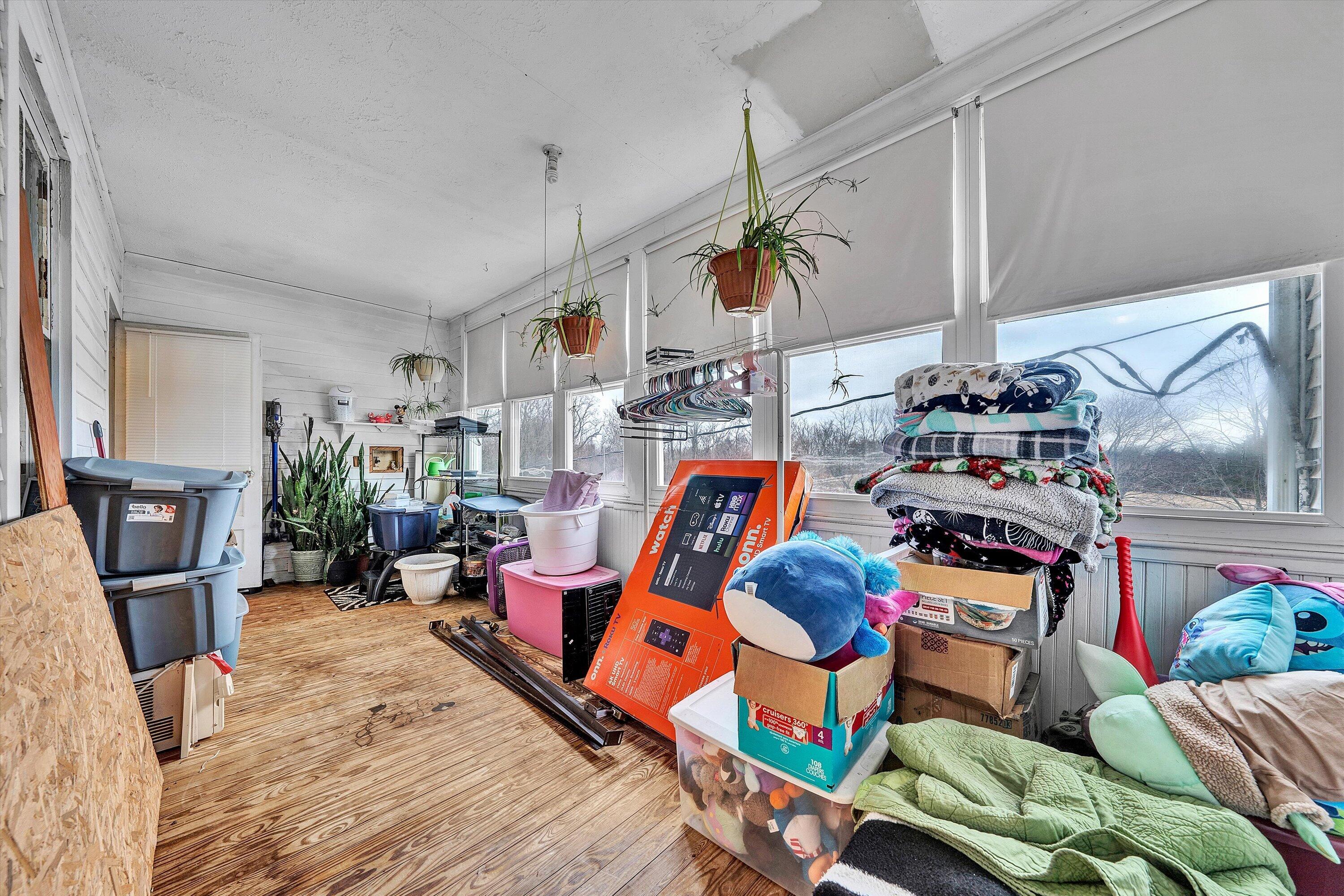 1045 Emerald Drive Goodview, VA 24095 - Photo 21 of 46 a bedroom with furniture and a wooden floor