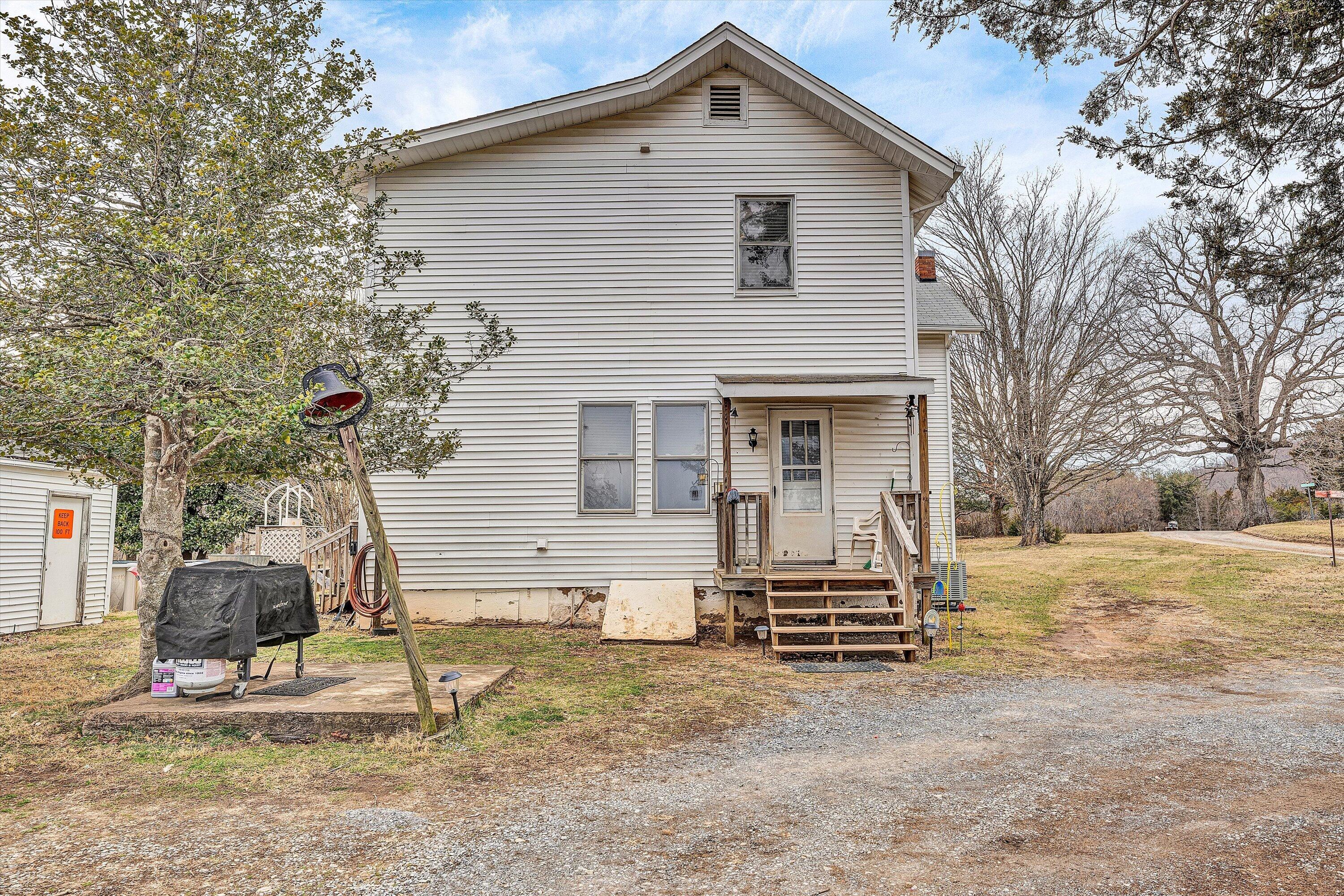 1045 Emerald Drive Goodview, VA 24095 - Photo 27 of 46 a front view of a house with a yard