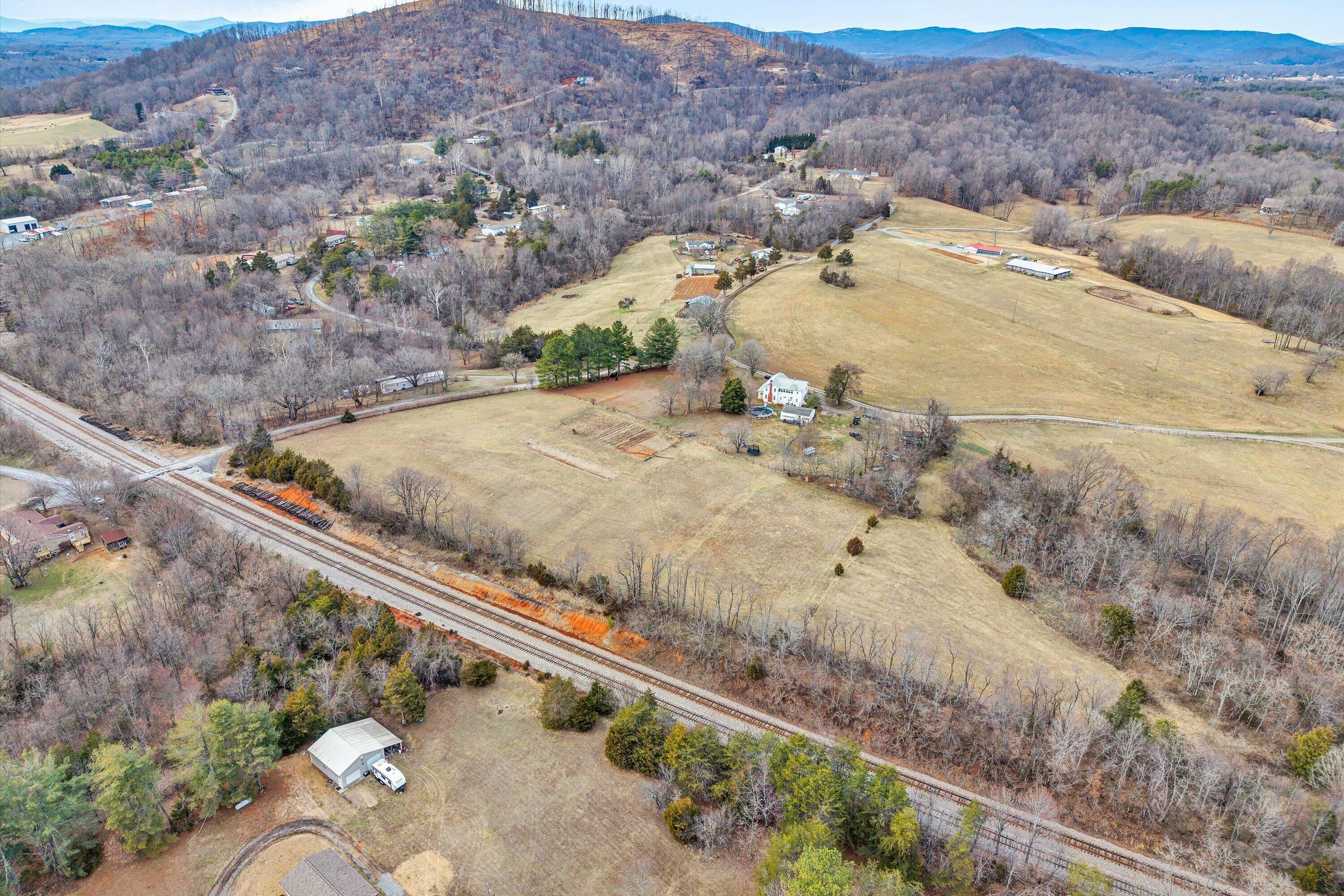 1045 Emerald Drive Goodview, VA 24095 - Photo 32 of 46 a view of a dry yard with mountains