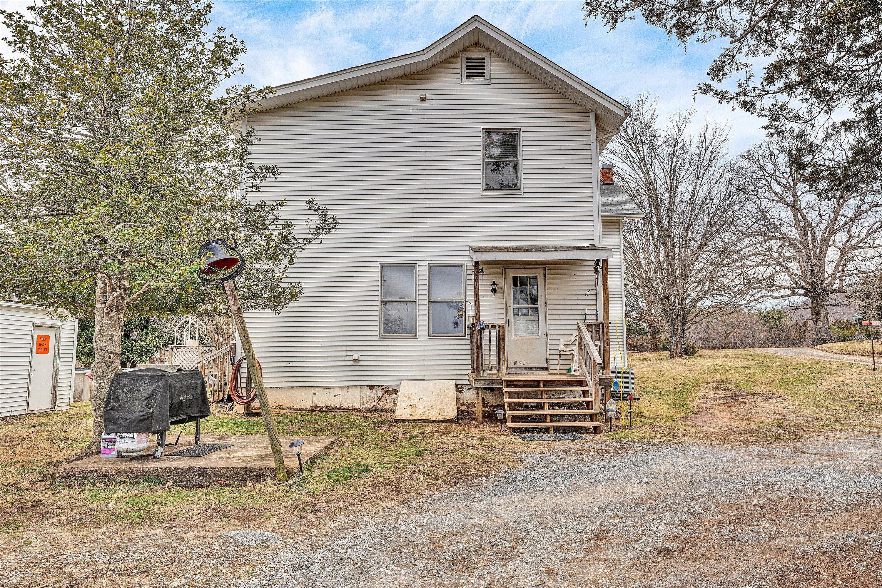 1045 Emerald Drive Goodview, VA 24095 - Photo 46 of 46 a front view of a house with garden