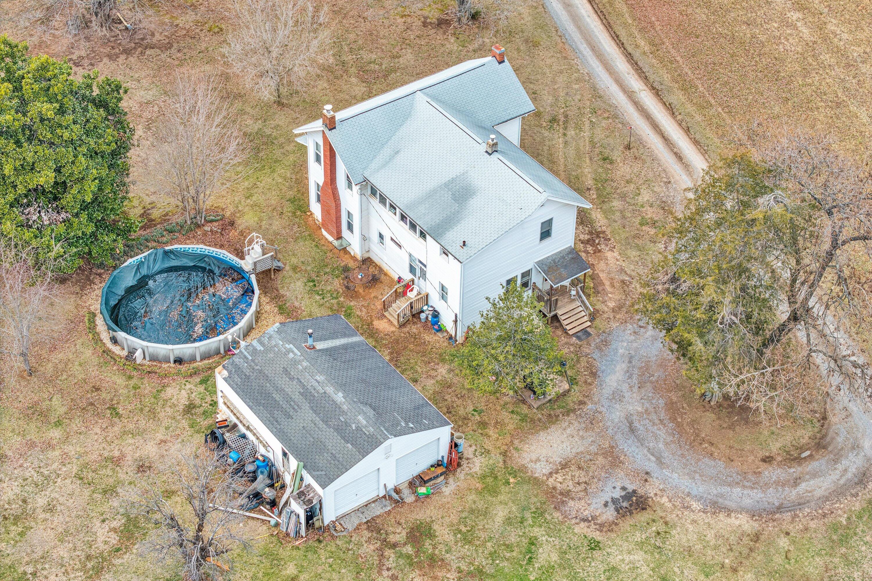 1045 Emerald Drive Goodview, VA 24095 - Photo 6 of 46 an aerial view of a house with a yard and a large tree