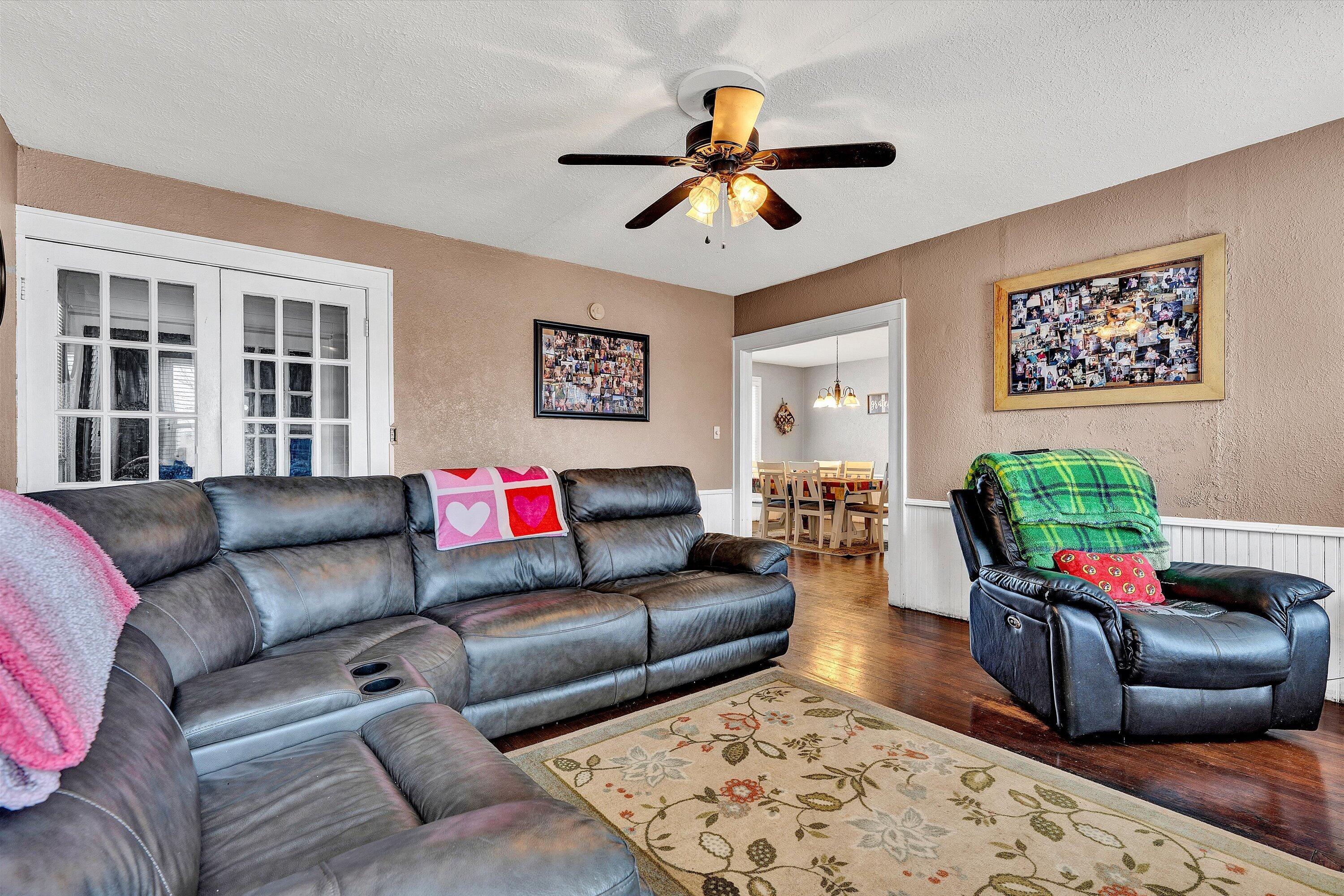 1045 Emerald Drive Goodview, VA 24095 - Photo 8 of 46 a living room with furniture and a flat screen tv